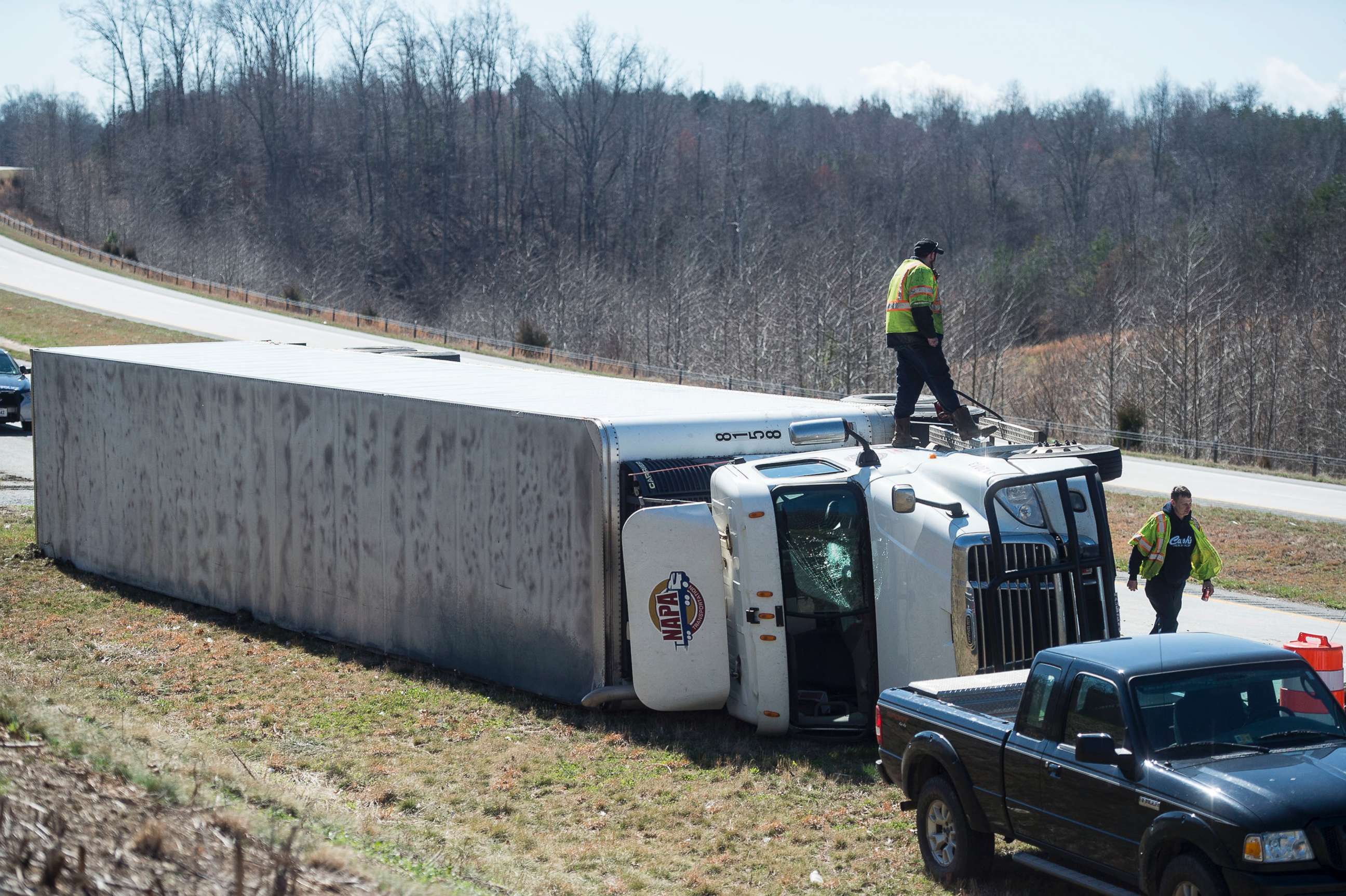 PHOTO: Fuel is siphoned from an overturned tractor-trailer on northbound 29 in Amhesrt, Va., March 2, 2018. Virginia's coast is bracing for possible flooding in the wake of the nor'easter that slammed into the East Coast. 