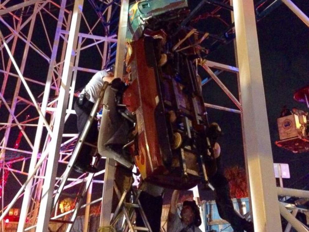 Firefighters in Daytona Beach, Florida, were called in to rescue 10 people trapped on a derailed roller coaster.