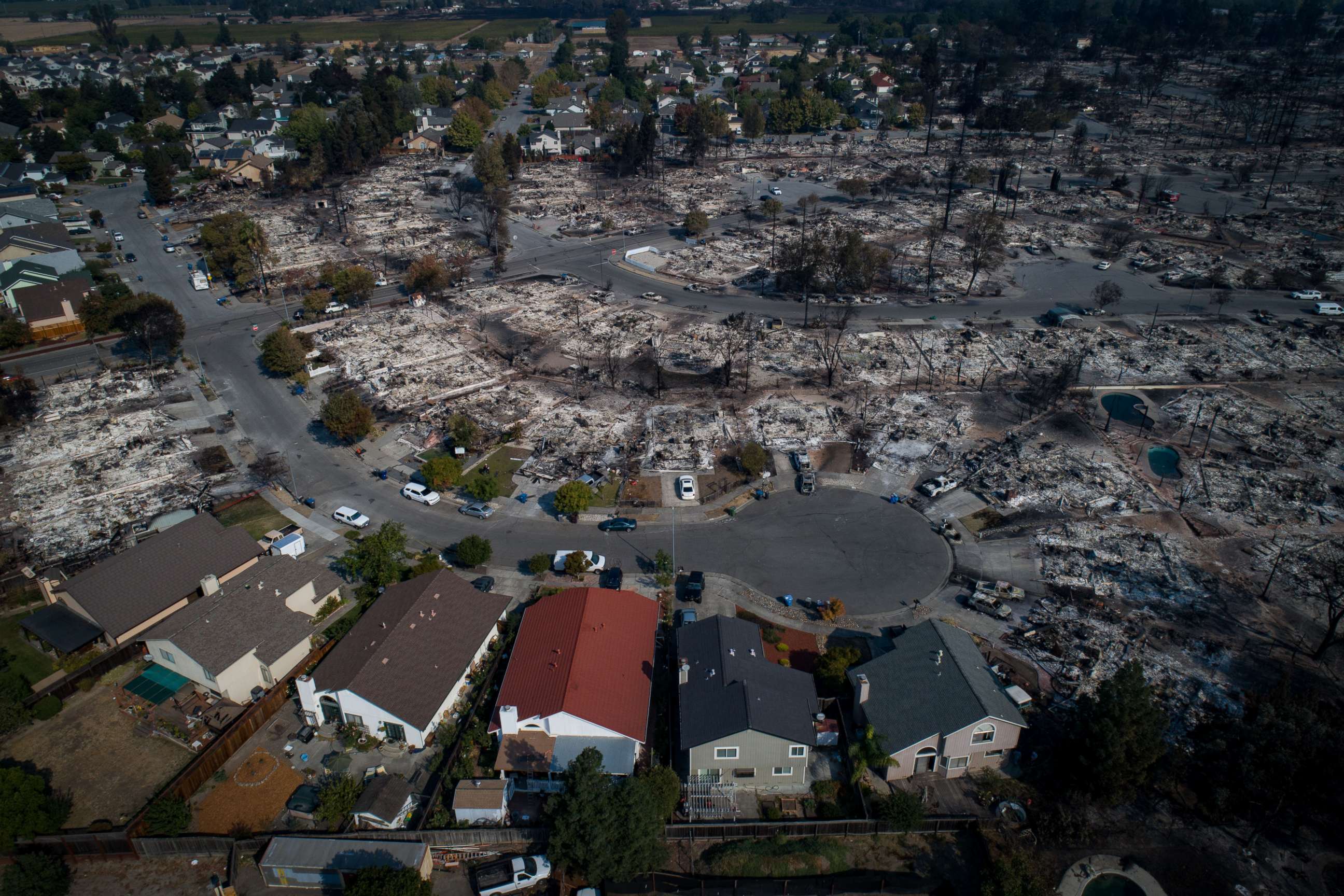 PHOTO: An aerial photograph shows a handful of homes that escaped destruction by wildfire in the Coffey Park neighborhood of Santa Rosa, Calif., Oct. 11, 2017.