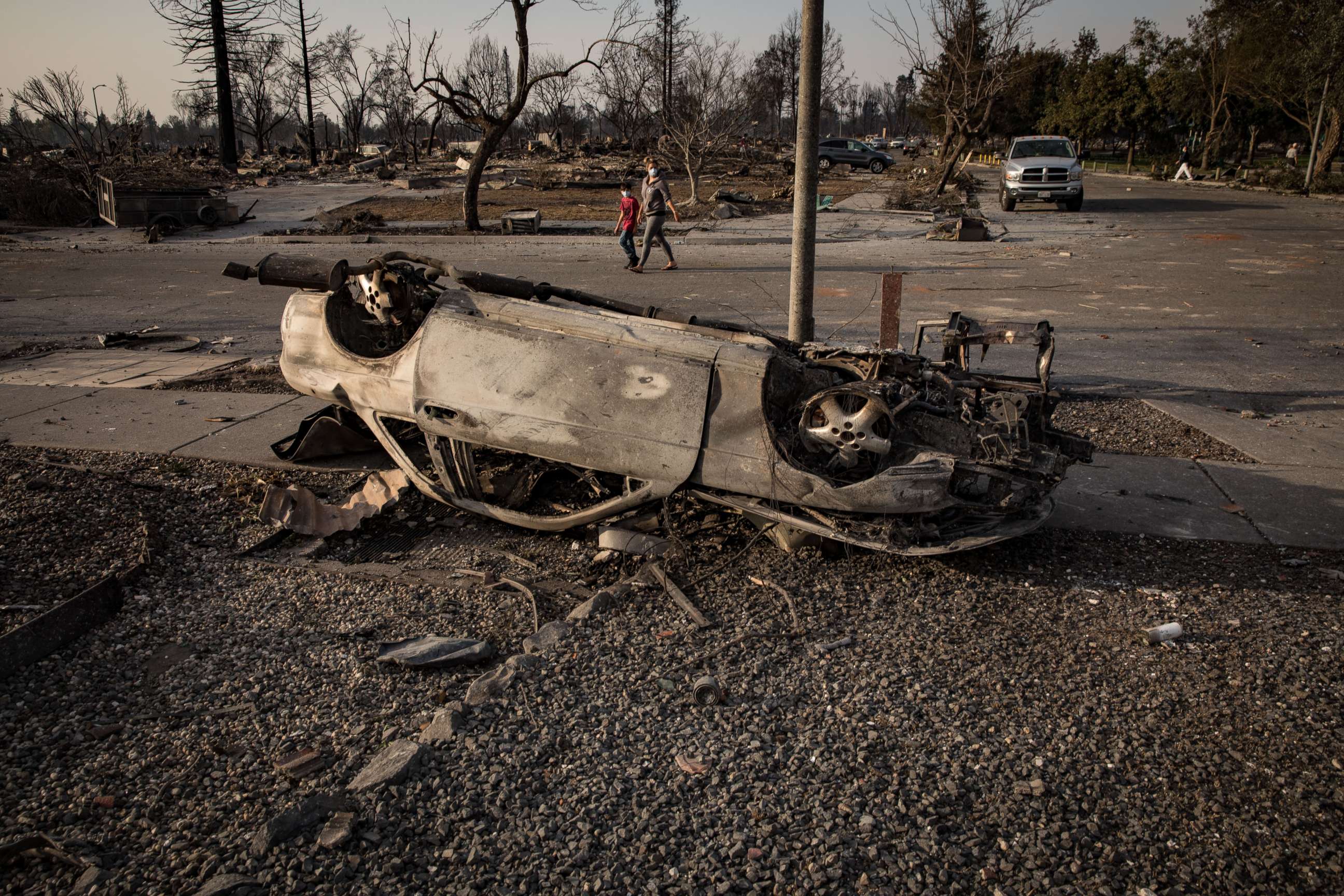 PHOTO: A burned-out car, likely knocked upside down by a gasoline explosion, sits in the ruins of the Coffey Park neighborhood of Santa Rosa, Calif., Oct. 11, 2017.