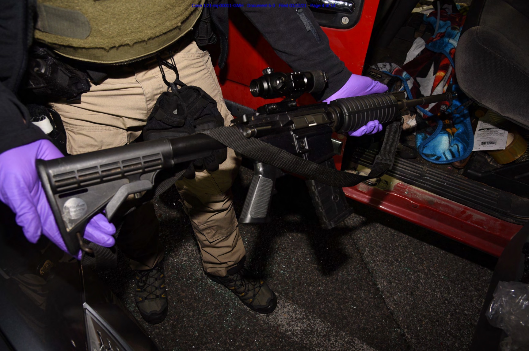 PHOTO: Law enforcement officials removed an AR-15-style semiautomatic rifle from a vehicle belonging to Lonnie Coffman near the site of U.S. Capitol protests on Jan. 6, 2021.