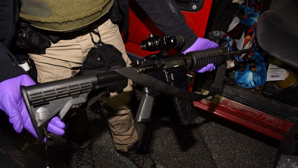 PHOTO: Law enforcement officials removed an AR-15-style semiautomatic rifle from a vehicle belonging to Lonnie Coffman near the site of U.S. Capitol protests on Jan. 6, 2021.