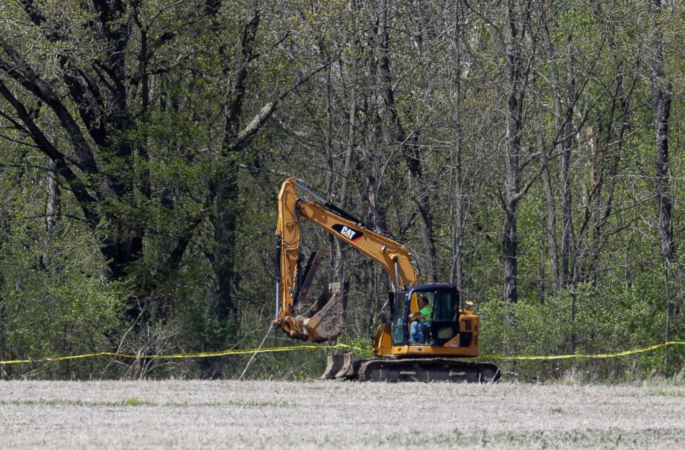 PHOTO: An excavator moves to a rural wooded area in Macomb Township, Mich., May 8, 2018. Authorities are searching w miles from downtown for the remains of a 12-year-old girl last seen in 1979.