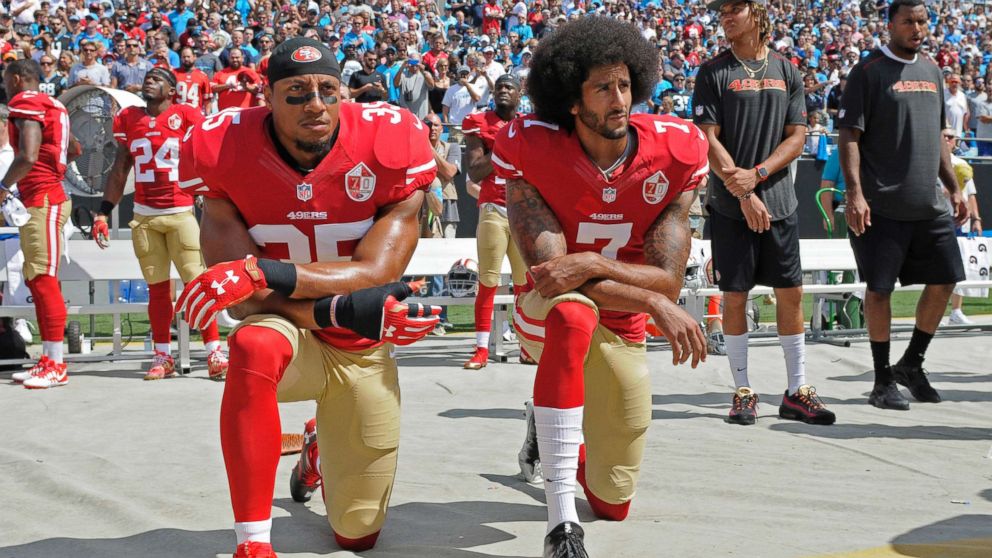 PHOTO: San Francisco 49ers' Colin Kaepernick (7) and Eric Reid (35) kneel during the national anthem before an NFL football game against the Carolina Panthers, in Charlotte, N.C., Sept. 18, 2016.