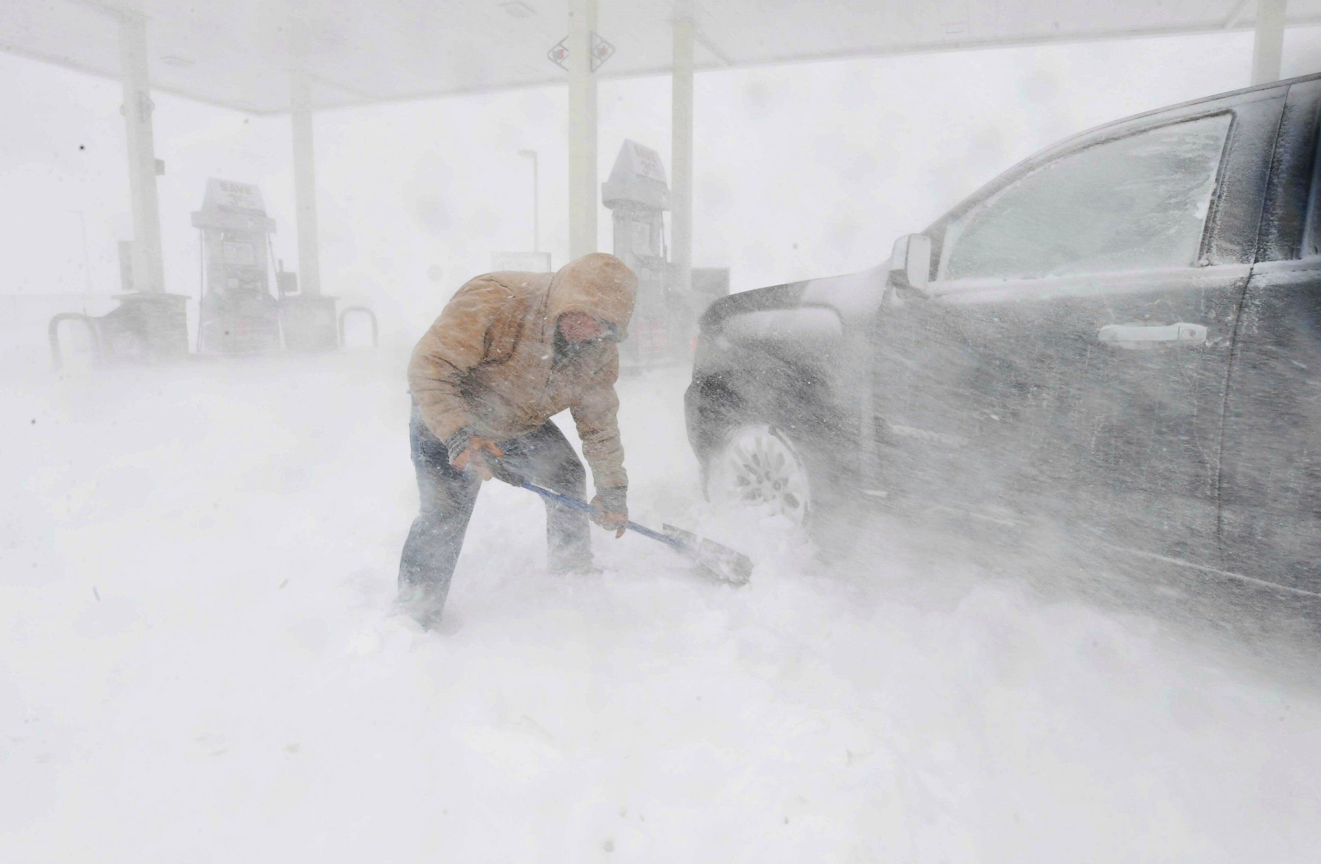 PHOTO: Greg Giannini tries to dig out his car near North Gate Blvd. in Colorado Springs, Colorado, on Wednesday, March 13, 2019.