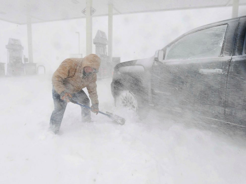 PHOTO: Greg Giannini tries to dig out his car near North Gate Blvd. in Colorado Springs, Colorado, on Wednesday, March 13, 2019.