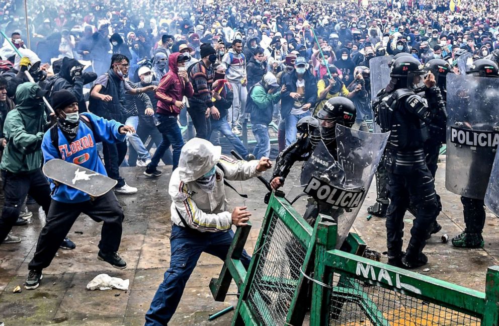 PHOTO: Demonstrators clash with riot police during a protest against a tax reform bill launched by Colombian President Ivan Duque, in Bogota, April 28, 2021.