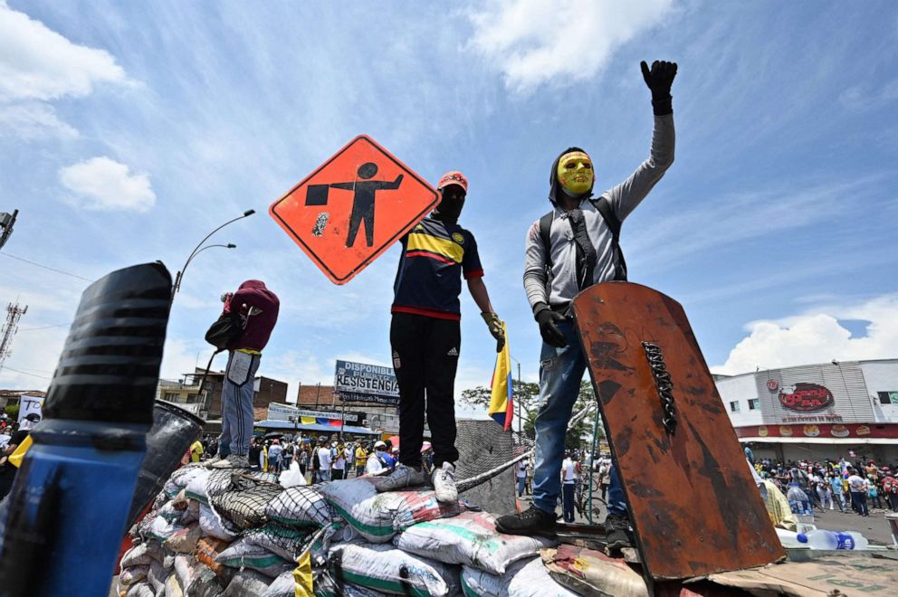 PHOTO: Demonstrators block a street with a barricade during a protest against President Ivan Duque's government in Cali, Colombia, May 5, 2021.
