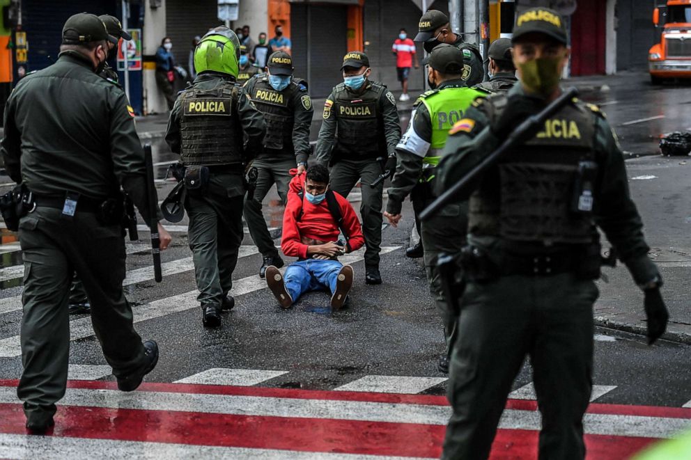 PHOTO: A man is arrested during clashes with the police following a protest against a tax reform bill launched by Colombian President Ivan Duque, in Medellin, Colombia, April 29, 2021. 