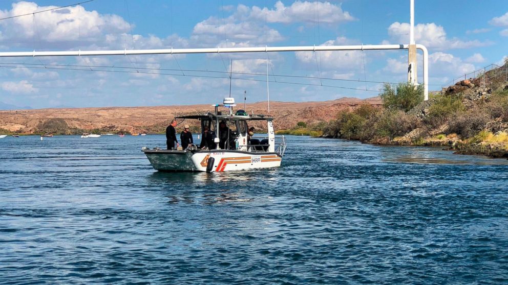 In this photo released by the San Bernardino County, Calif., Sheriff's Office, shows search and recovery operations Monday, Sept. 3, 2018, for three people missing after two boats collided Saturday evening on the Colorado River near Topock, Ariz.
