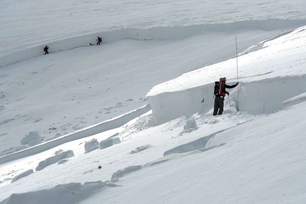 PHOTO: In this April 21, 2013, file photo, members of the Colorado Avalanche Information Center or CAIC, takes depth measurements every 50 feet at the crown of the avalanche in an area known as Sheep Creek near Loveland Pass in Colorado.