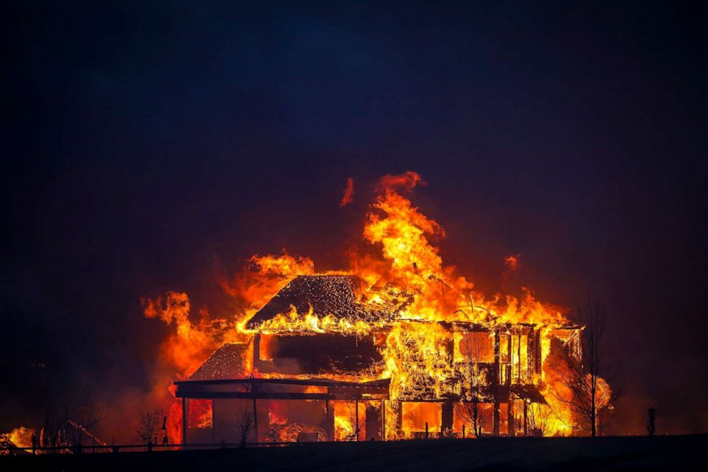 PHOTO: A home burns after a fast moving wildfire swept through the area in the Centennial Heights neighborhood of Louisville, Colo., on Dec. 30, 2021. State officials estimated some 600 homes had already been lost in multiple areas around Boulder County.