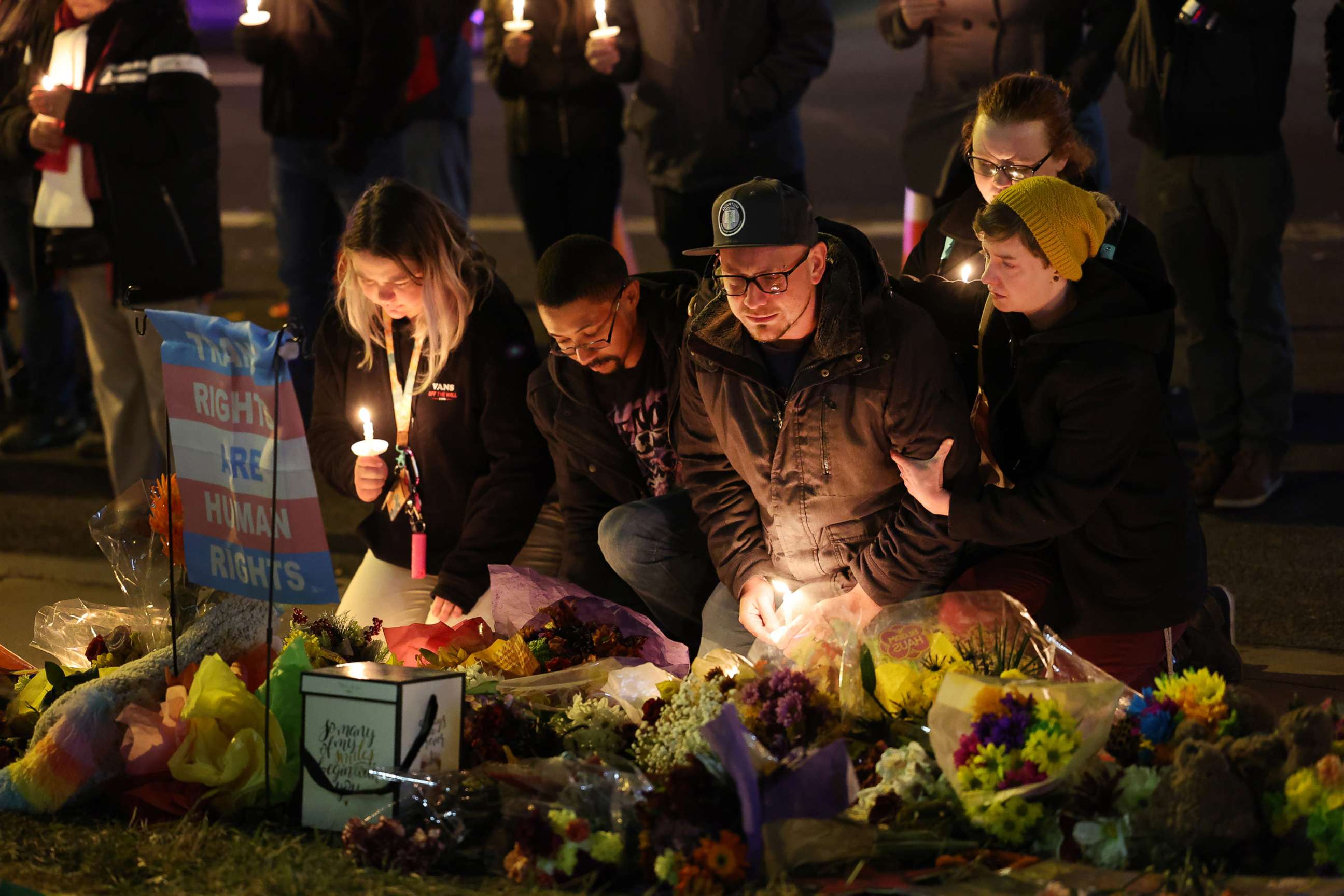 PHOTO: People hold a vigil at a makeshift memorial near the Club Q nightclub, Nov. 20, 2022, in Colorado Springs, Colorado. 