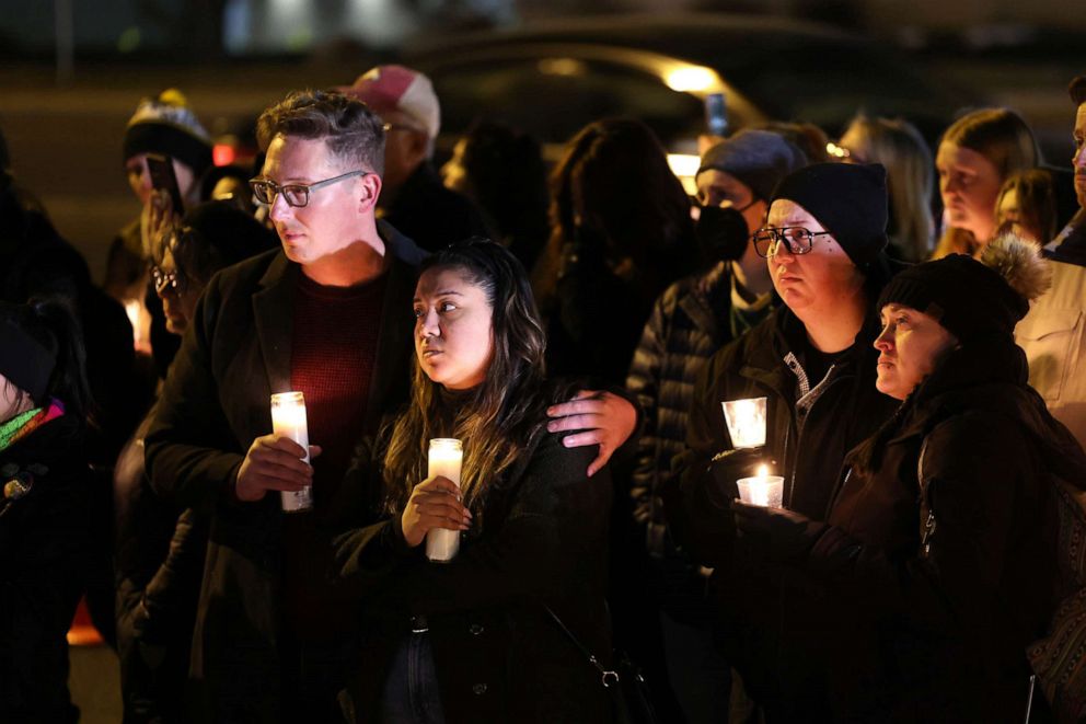 PHOTO: People visit a makeshift memorial near the Club Q nightclub, Nov. 21, 2022 in Colorado Springs, Colorado.