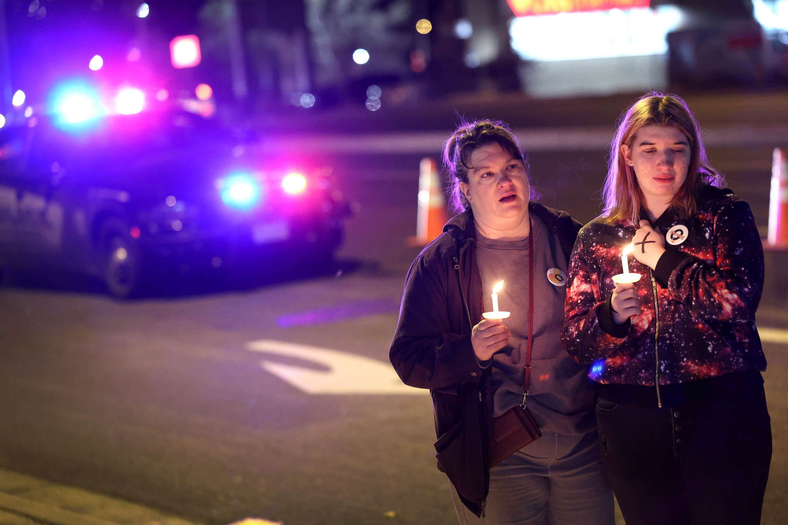 PHOTO: People hold a vigil at a makeshift memorial near the Club Q nightclub, Nov. 20, 2022 in Colorado Springs, Colorado. 