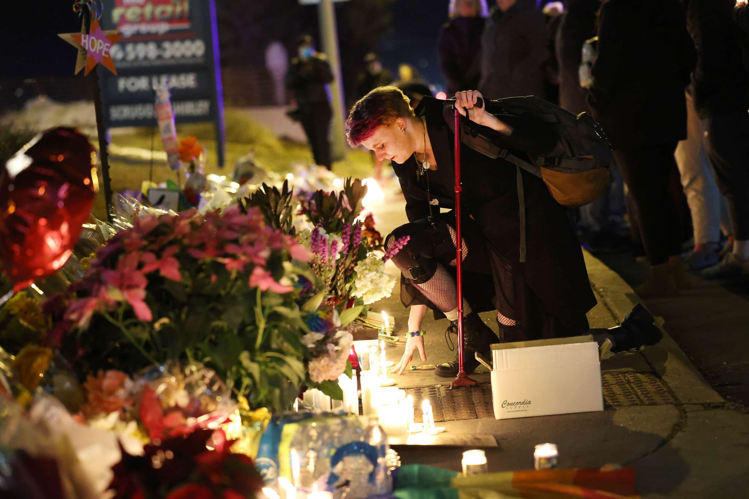 PHOTO:People hold a vigil at a makeshift memorial near the Club Q nightclub, Nov. 20, 2022 in Colorado Springs, Colorado.