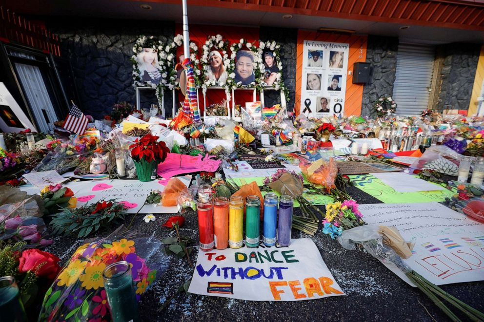 PHOTO: Flowers, candles, and mementos left at a memorial after a mass shooting at LGBTQ nightclub Club Q, Nov. 26, 2022, in Colorado Springs, Colo. 
