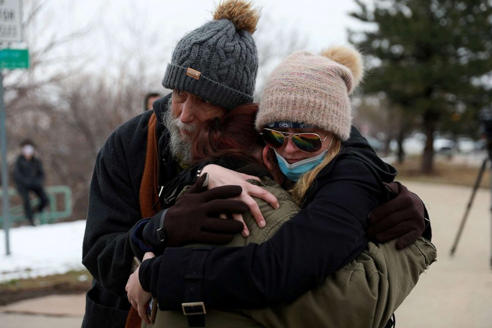 PHOTO: Sarah Moonshadow is comforted by David and Maggie Prowell after she was inside King Soopers grocery store during a shooting in Boulder, Colo., March 22, 2021.