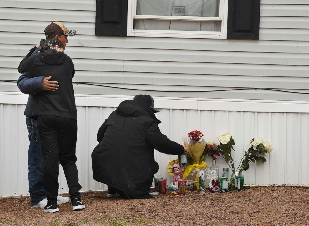 PHOTO: Mourners organize a memorial, May 10, 2021, outside a mobile home in Colorado Springs, Colo., where a shooting at a party took place a day earlier that killed six people before the gunman took his own life.
