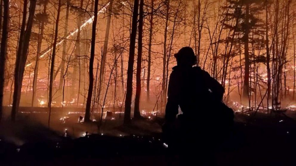 PHOTO: A firefighter is silhouetted as Cameron Peak Fire, the largest wildfire in Colorado's history, burns outside Drake, Colo., Oct.17, 2020.