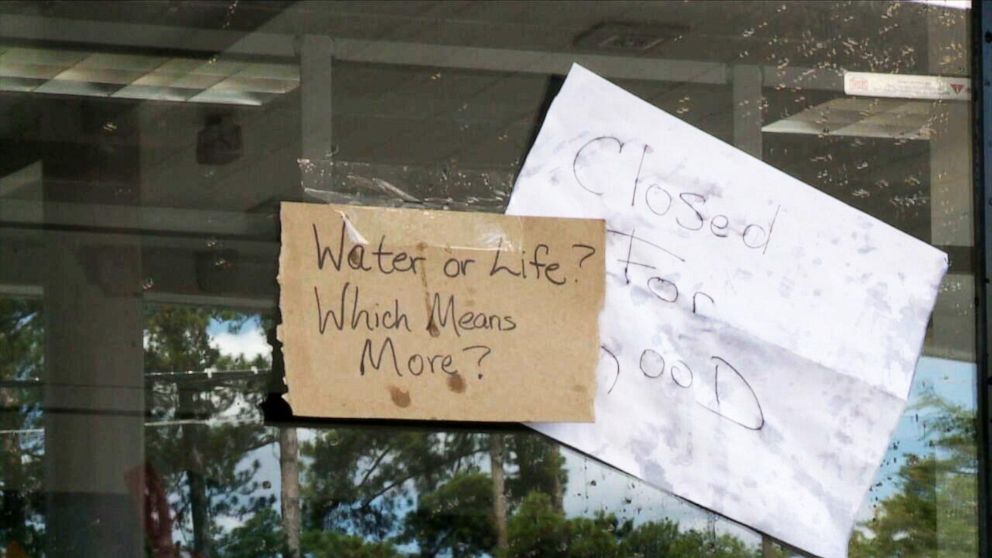 PHOTO: Signs are posted on the door of a Shell station in Columbia, South Carolina, where a 14-year old was fatally shot.