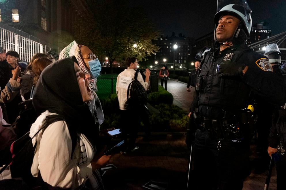 PHOTO: Pro-Palestine student activists face off with New York Police Department officers during a raid on Columbia University's campus at the request of Columbia University President Minouche Shafik on Tuesday evening, April 30, 2024 in New York.