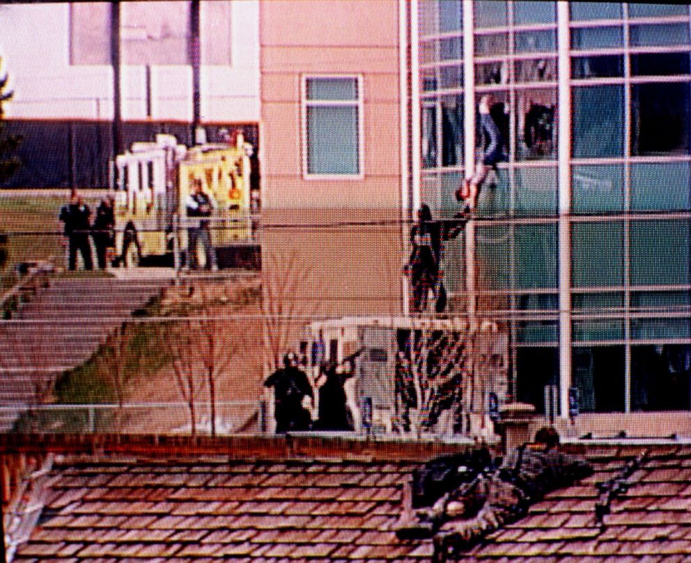 In this image from television, a Columbine High School student is rescued by emergency personnel during the shooting spree at the school in the southwest Denver suburb of Littleton, Colo., April 20, 1999.