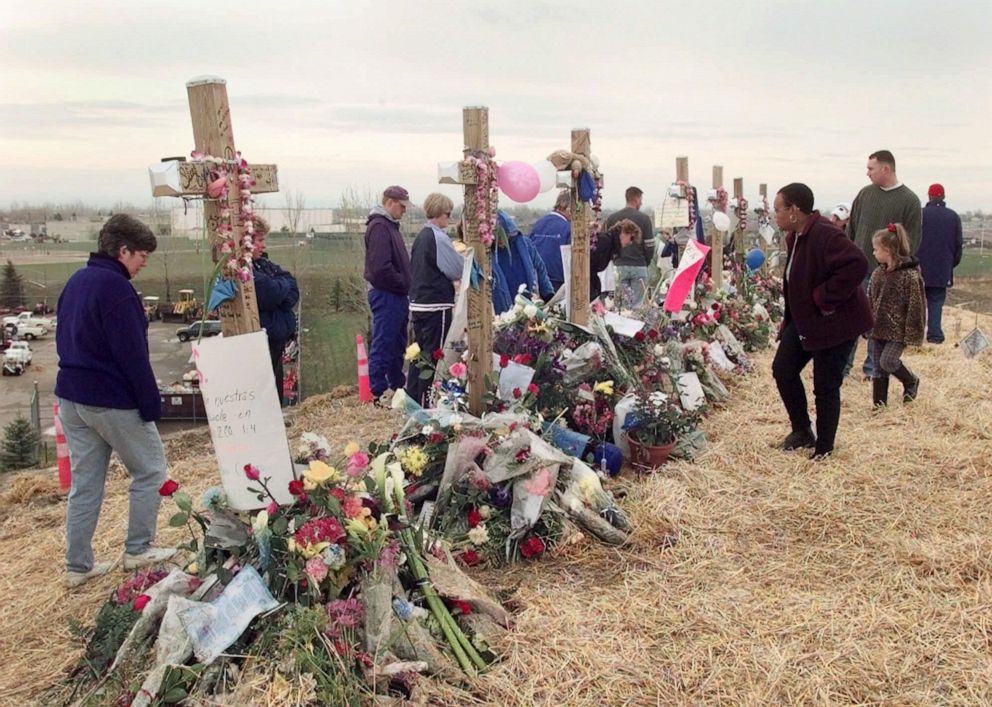 PHOTO: Mourners visit a memorial of crosses on a hill overlooking Columbine High School in Littleton, Colo., on May 1, 1999.