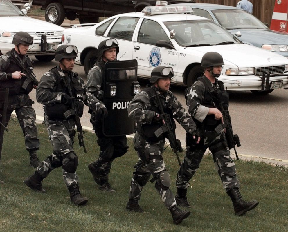 PHOTO: Members of a police SWAT march to Columbine High School in Littleton, Colo., April 20, 1999.