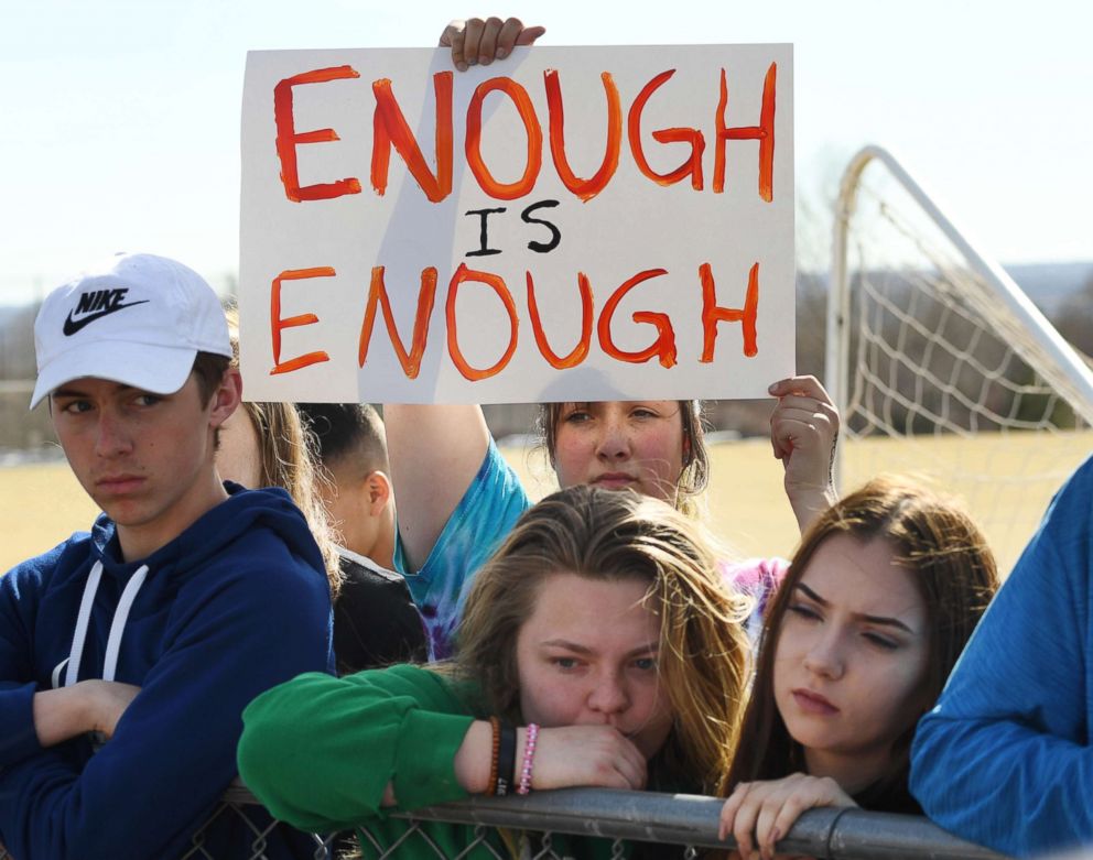 PHOTO: Leah Zundel, 15, a student at Columbine High School, holds a sign that reads Enough is Enough as she and other students walked out of classes in protest of gun violence for 17 minutes, March 14, 2018 in Littleton, Colo.