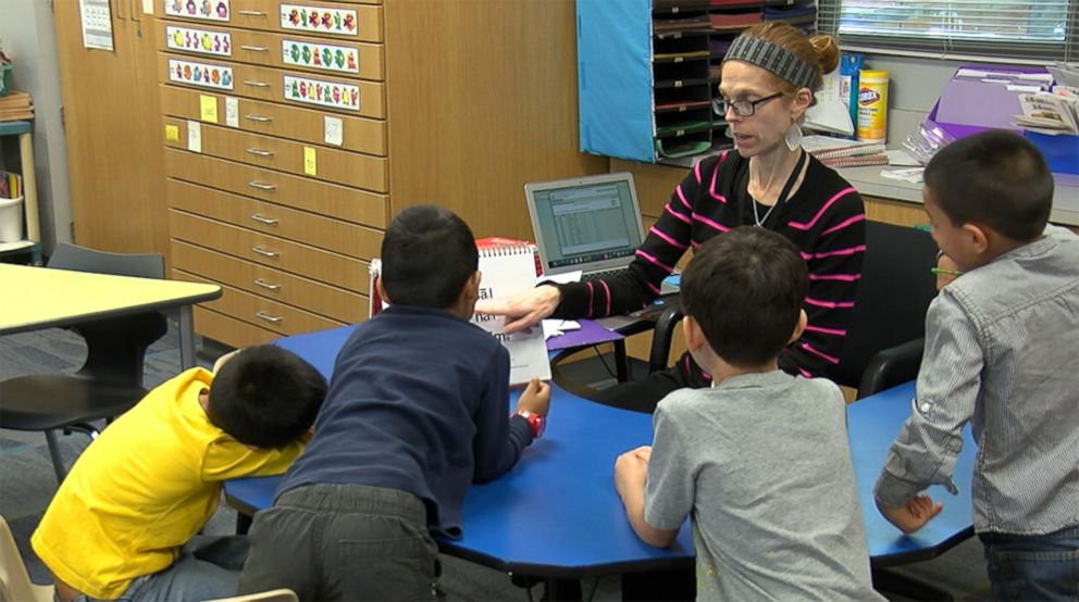 PHOTO: Michelle Porter, 37, a Columbine High School shooting survivor, teaches a lesson to her students at McGregor Primary School in Texas.