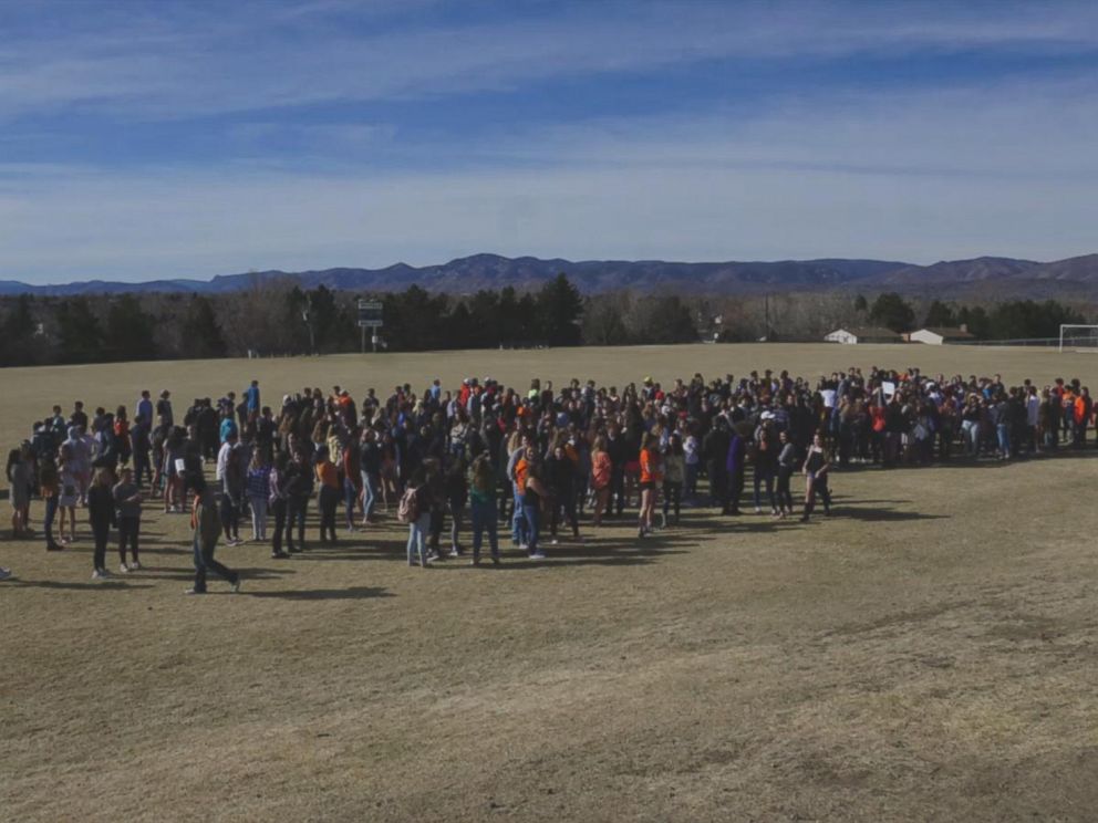 PHOTO: Columbine High School students walk out of classes to demand stricter gun laws as part of a nationwide protest on March 14, 2018, in Littleton, Colo., one month after the Florida high school shootings.