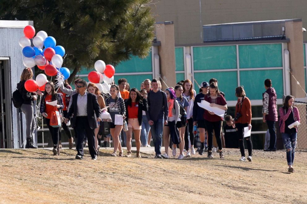 PHOTO: Columbine High School students, led by former Columbine principal Frank DeAngelis, walk outside during a National School Walkout to honor the 17 students and staff killed at Marjory Stoneman Douglas High School, Littleton, Colo., on March 14, 2018.