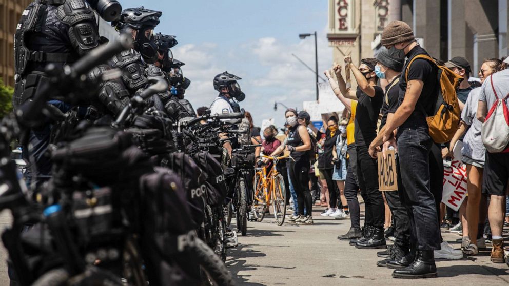 PHOTO: Protesters confront police officers standing in the middle of the street in Columbus, Ohio, during a demonstration against the murder of George Floyd under police custody, May 30, 2020.