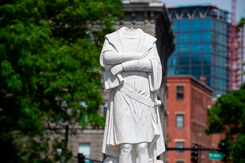 PHOTO: A decapitated statue of Christopher Columbus stands in Christopher Columbus Park in Boston, June 10, 2020. 