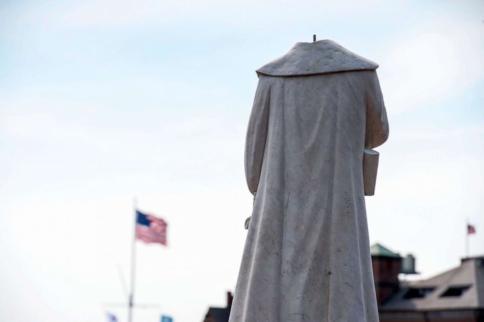 PHOTO: A decapitated statue of Christopher Columbus stands in Christopher Columbus Park in Boston, June 10, 2020. 