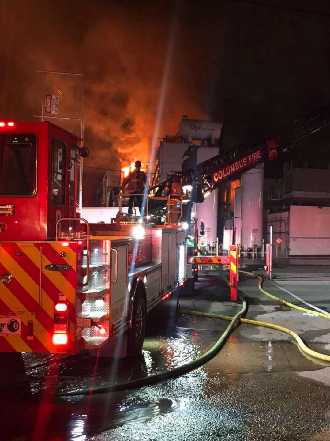 PHOTO: Firefighters work to contain an explosion and fire at a paint manufacturing plant overnight, April 8, 2021, in Columbus, Ohio.