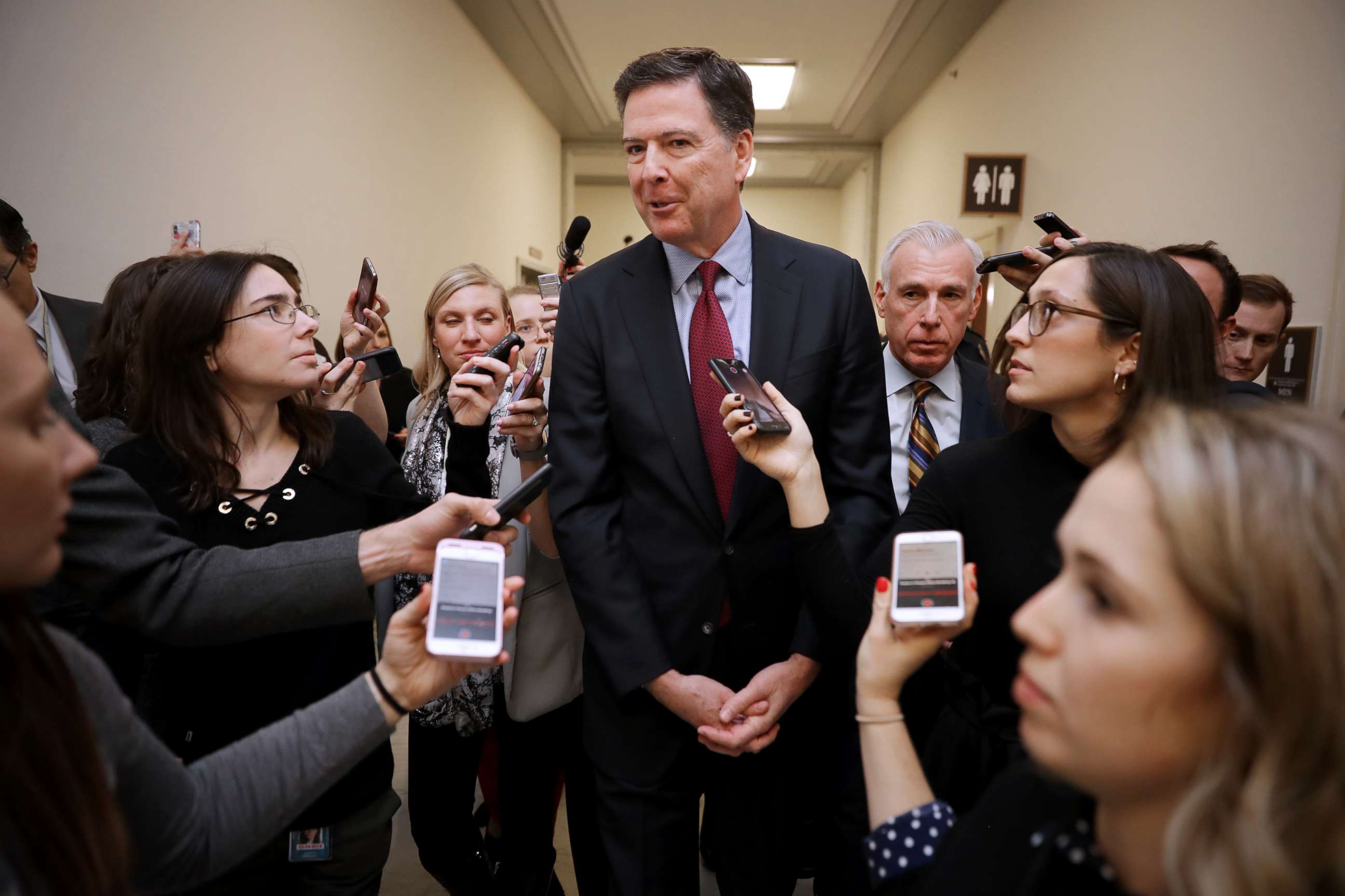 PHOTO: James Comey is surrounded by reporters after testifying to the House Judiciary and Oversight and Government Reform committees on Capitol Hill, Dec. 7, 2018.