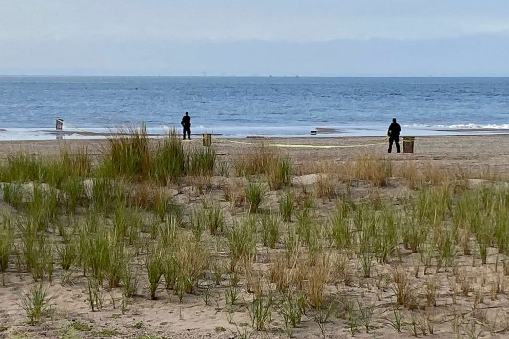 PHOTO: New York Police Department investigators investigate a stretch of beach off Coney Island where three children were found dead in the surf on Sept. 12, 2022, in New York.  Authorities have confirmed that the children died from drowning.