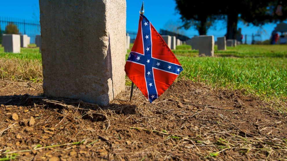 A confederate flag is put next to a gravestone in a cemetery, in this undated file photo.
