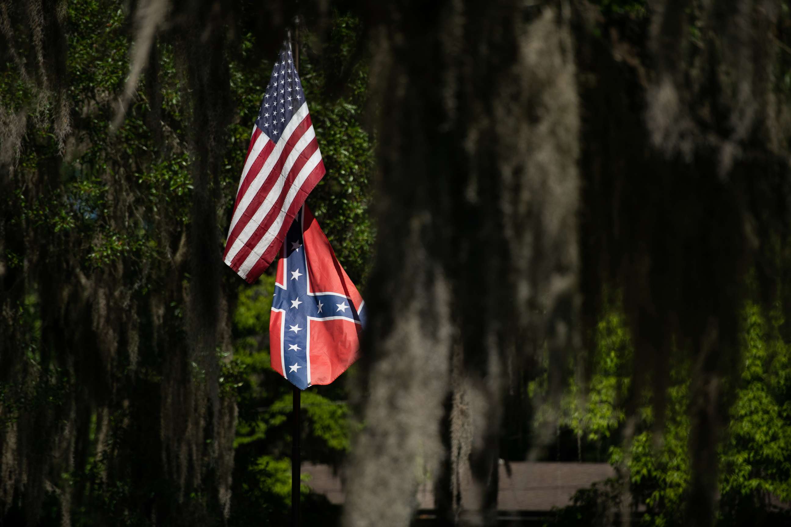 PHOTO: American and Confederate flags fly at a residence, May 7, 2020, in Brunswick, Georgia.