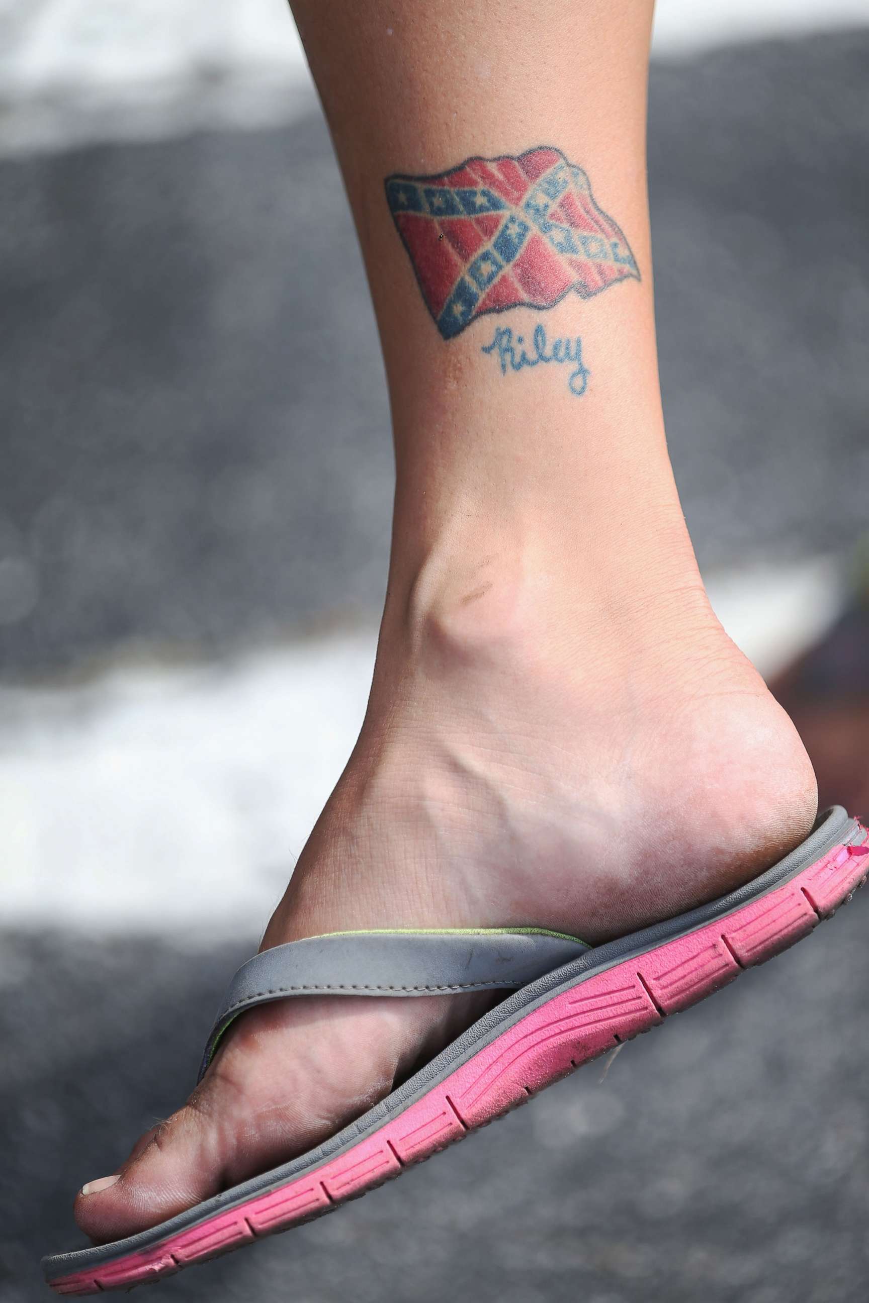 PHOTO: In this July 11, 2015, file photo, a Confederate flag tattoo is seen on a leg during a rally in Florida.