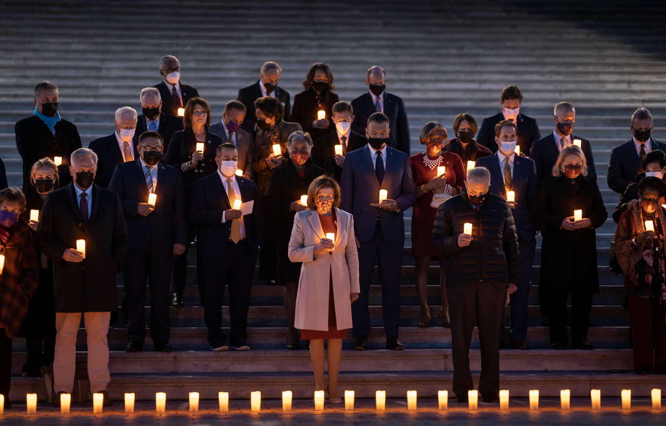 PHOTO: Speaker of the House Nancy Pelosi and other bipartisan members of House and Senate, hold a moment of silence for 800,000 American lives lost to COVID-19, on the steps of the Capitol in Washington, Dec. 14, 2021.