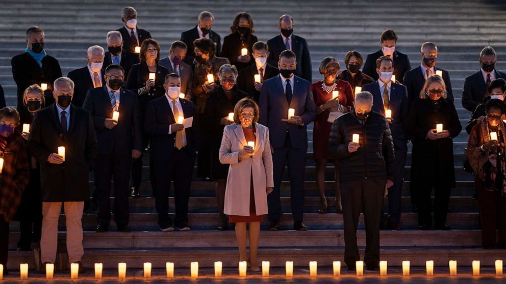 PHOTO: Speaker of the House Nancy Pelosi and other bipartisan members of House and Senate, hold a moment of silence for 800,000 American lives lost to COVID-19, on the steps of the Capitol in Washington, Dec. 14, 2021.