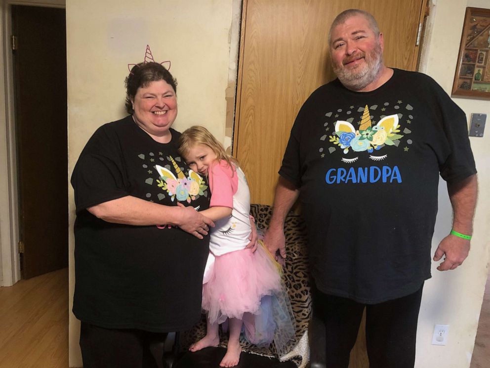 PHOTO: Heather and Marvin Griffin hold their granddaughter in photo taken before they contracted coronavirus.