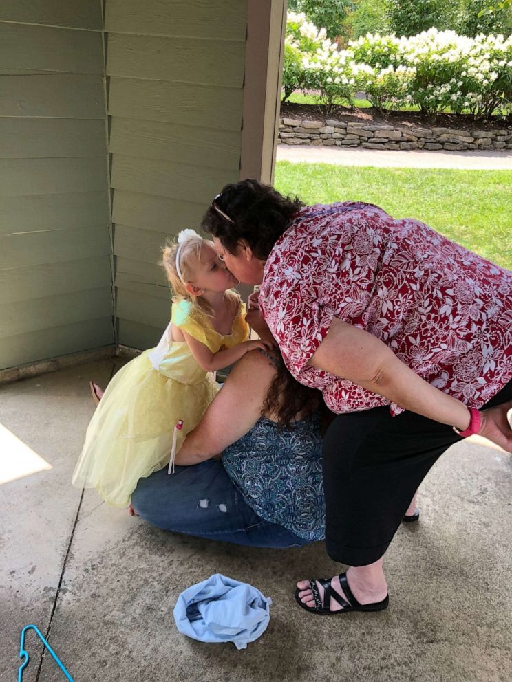 PHOTO: Connie kisses her granddaughter in photo taken before she contracted Coronavirus.