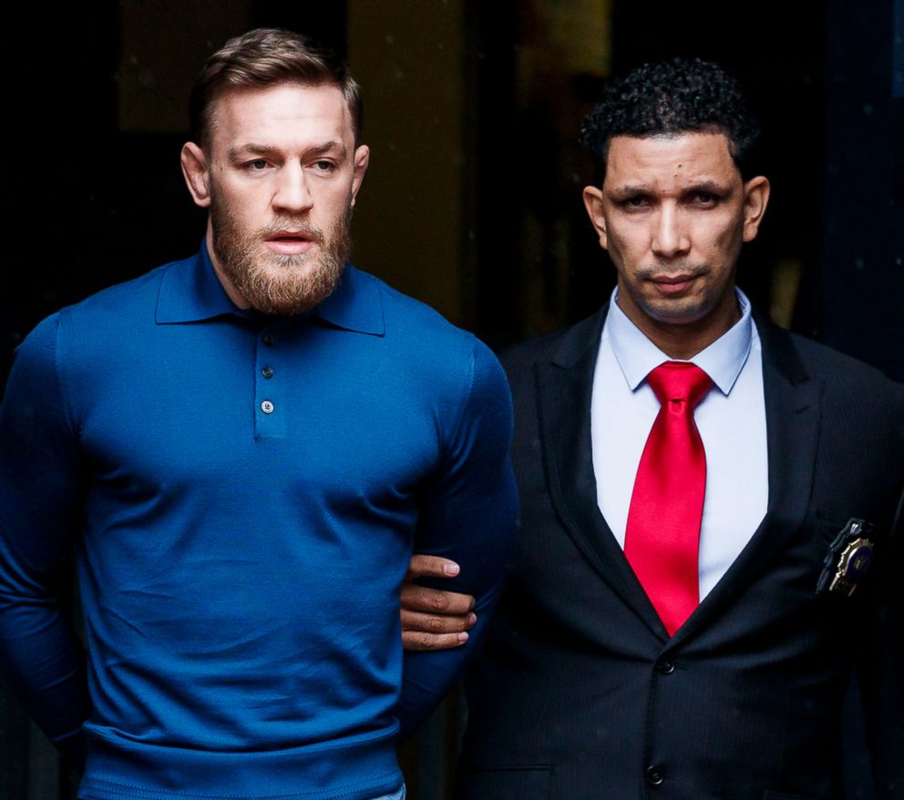 PHOTO: Mixed martial arts fighter Conor McGregor is escorted from a New York City police precinct after he turned himself and was arrested and charged with three counts of assault and one count of criminal mischief in Brooklyn, N.Y., April 6, 2018.