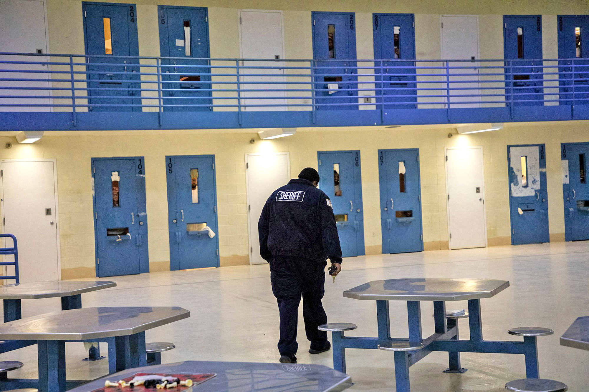 PHOTO: A Sheriff walks towards detainee cells at Cook County jail in Chicago, May 20, 2020.  