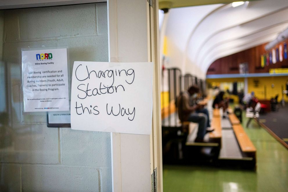 PHOTO: A sign for a charging station at a cooling center at the Milne Recreation Center in the Gentilly neighborhood of New Orleans which was still out of power more than a week after Hurricane Ida, Sept. 6, 2021.