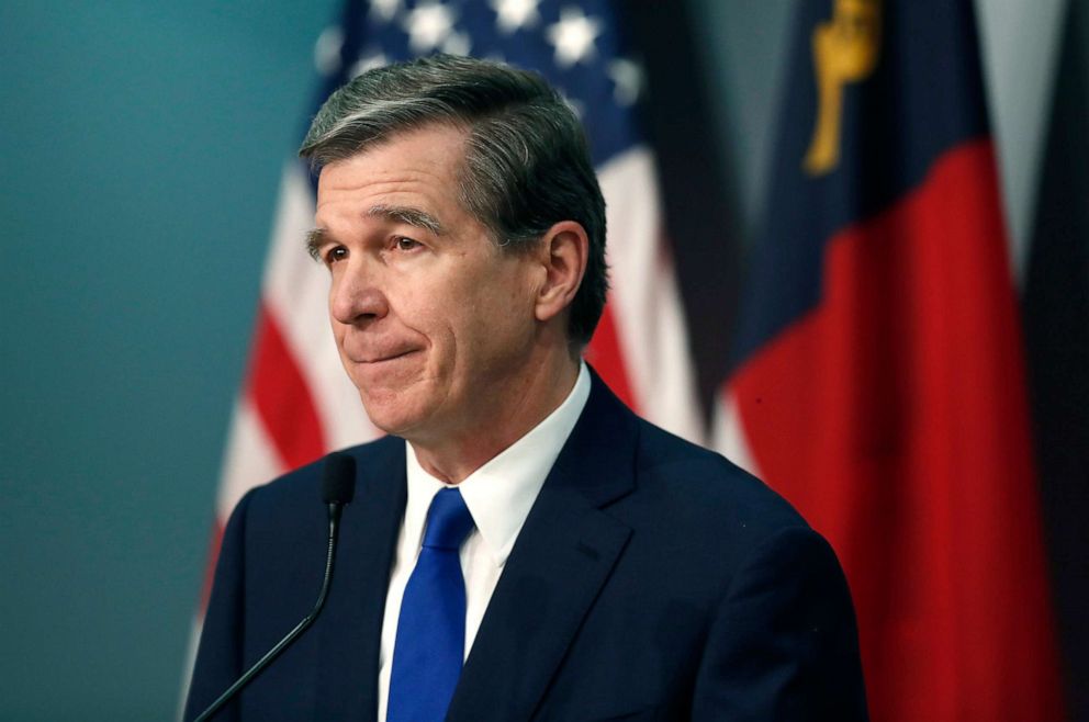 PHOTO: North Carolina Gov. Roy Cooper listens to a question during a briefing on the coronavirus pandemic at the Emergency Operations Center in Raleigh, N.C., May 20, 2020.